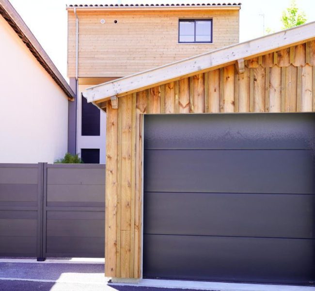 aluminum-modern-home-with-grey-gate-portal-modern-garage-door-wooden-house